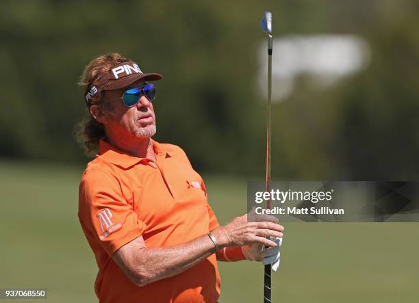 Miguel Angel Jimenez of Spain watches his third shot on the first hole during the first round of the Rapiscan Systems Classic at Fallen Oak Golf...