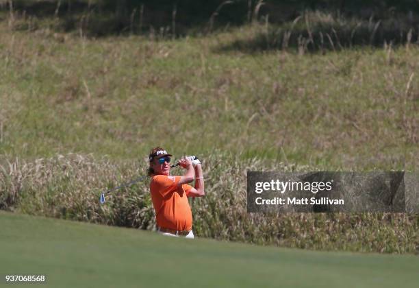 Miguel Angel Jimenez of Spain watches his second shot on the first hole during the first round of the Rapiscan Systems Classic at Fallen Oak Golf...