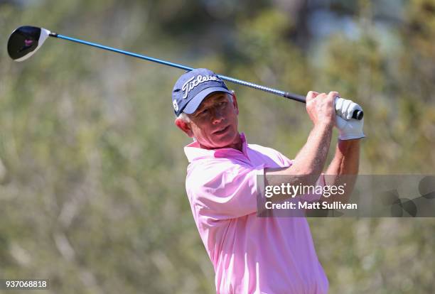 Mike Goodes watches his tee shot on the 11th hole during the first round of the Rapiscan Systems Classic at Fallen Oak Golf Course on March 23, 2018...