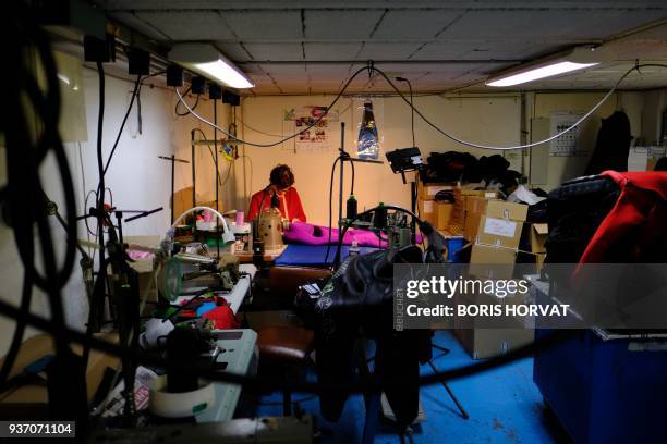 Technician checks a wetsuit at Beuchat, an underwater equipment designer and manufacturer, in Marseille on January 30, 2018. / AFP PHOTO / BORIS...