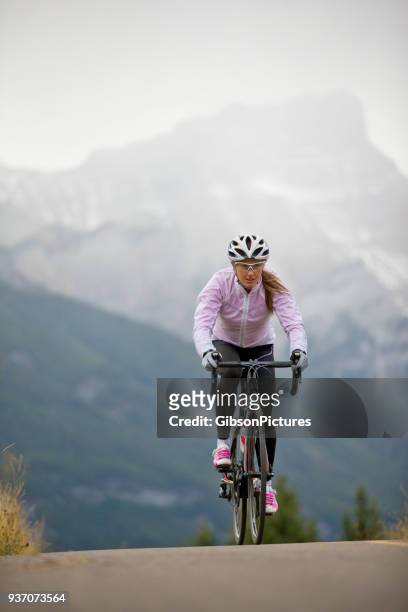 rocky mountain road bike girl - rocky road stock pictures, royalty-free photos & images