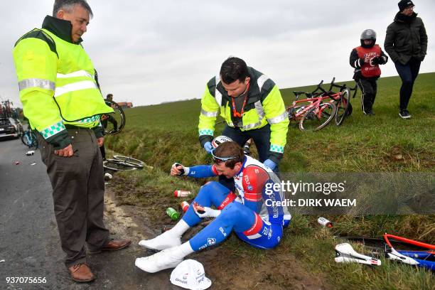 French Mickael Delage of FDJ sits on the verge after a fall during the 61st edition of the 'E3 Prijs Vlaanderen Harelbeke' cycling race 5 km from and...