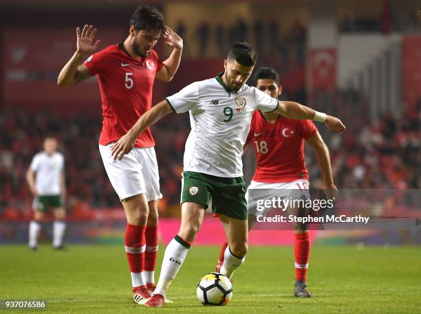 Antalya , Turkey - 23 March 2018; Shane Long of Republic of Ireland in action against Okay Yokulu, left, and Emre Akbaba of Turkey during the...