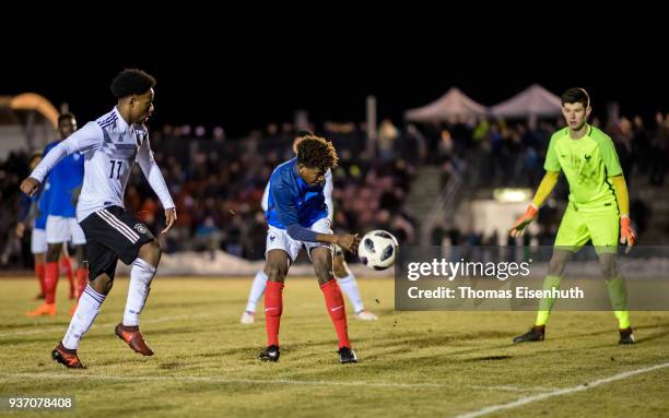John Yeboah of Germany and Andy Pelmard of France vie for the ball during the U18 international friendly match between Germany and France at Ilburg...