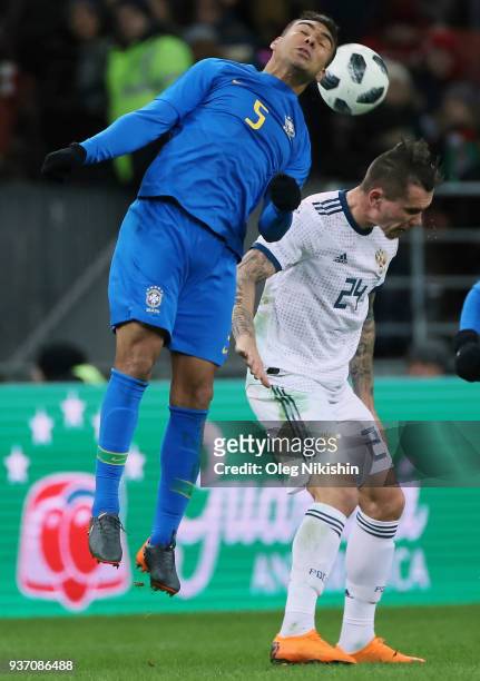 Anton Zabolotny of Russia vies for the ball with Casemiro of Brazil during the International friendly match between Russia and Brazil at Luzhniki...