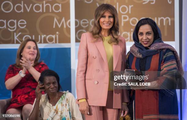 First Lady Melania Trump presents a 2018 International Women of Courage Award to Roya Sadat of Afghanistan during the Award Ceremony at the State...