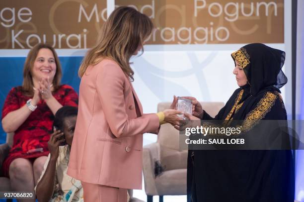 First Lady Melania Trump presents a 2018 International Women of Courage Award to Aliyah Khalaf Saleh of Iraq during the Award Ceremony at the State...