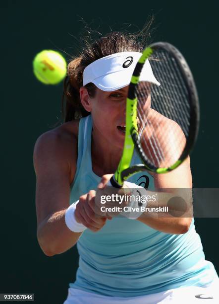 Johanna Konta of Great Britain plays a backhand against Kirsten Flipkens of Belgium in their second round match during the Miami Open Presented by...