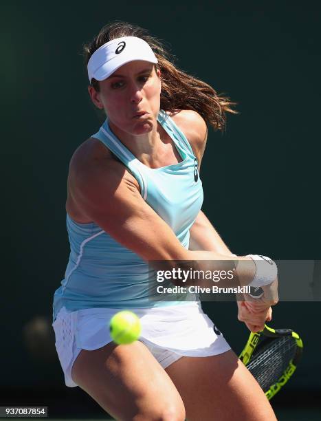 Johanna Konta of Great Britain plays a backhand against Kirsten Flipkens of Belgium in their second round match during the Miami Open Presented by...