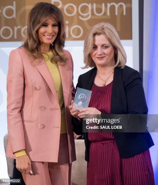 First Lady Melania Trump presents a 2018 International Women of Courage Award to Dr. Feride Rushiti of Kosovo during the Award Ceremony at the State...