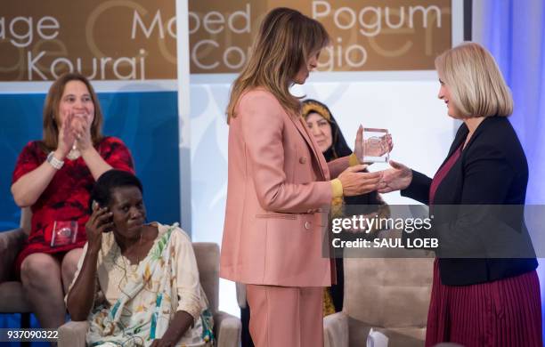 First Lady Melania Trump presents a 2018 International Women of Courage Award to Dr. Feride Rushiti of Kosovo during the Award Ceremony at the State...