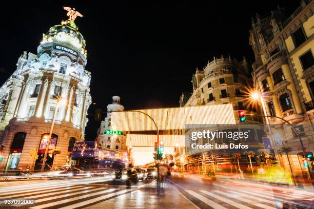 illuminated gran via and metropolis building. - アルカラ通り ストックフォトと画像