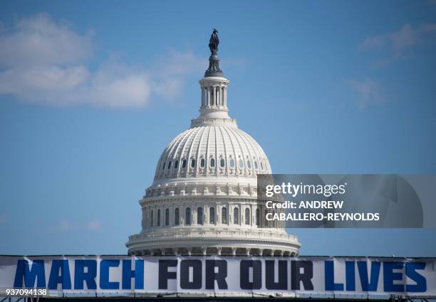 The March For Our Lives stage sign is seen near the capitol ahead of the anti-gun rally in Washington, DC, on March 23, 2018.