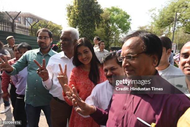 Aam Aadmi Party MLA Alka Lamba and others flash a victory sign after Delhi High Court restored the membership of 20 AAP MLAs in the office of profit...