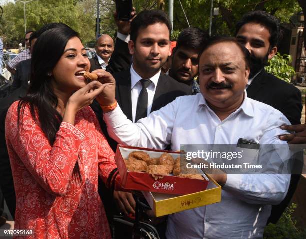 Aam Aadmi Party MLAs Rajesh Rishi and Alka Lamba celebrate after Delhi High Court restored the membership of 20 AAP MLAs in the office of profit...