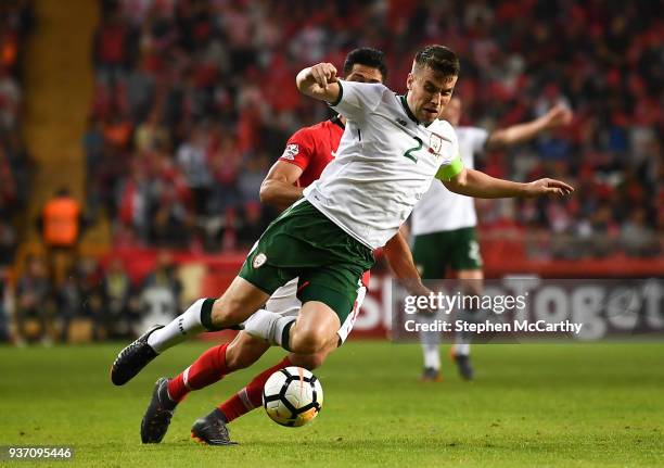 Antalya , Turkey - 23 March 2018; Seamus Coleman of Republic of Ireland is tackled by Emre Akbaba of Turkey during the International Friendly match...