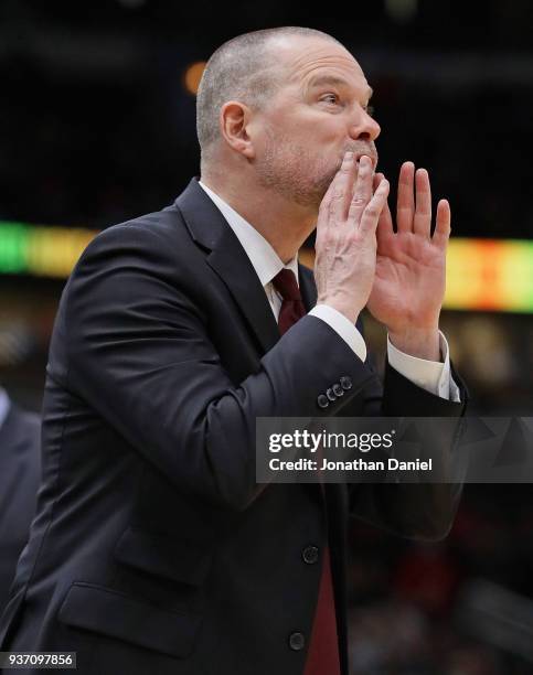 Head coach Michael Malone of the Denver Nuggets gives instructions to his team against the Chicago Bulls at the United Center on March 21, 2018 in...