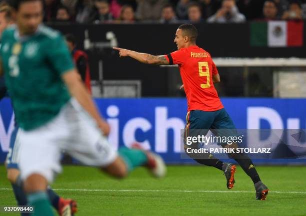 Spain's forward Rodrigo celebrates after scoring the 0-1 during the international friendly football match of Germany vs Spain in Duesseldorf, western...