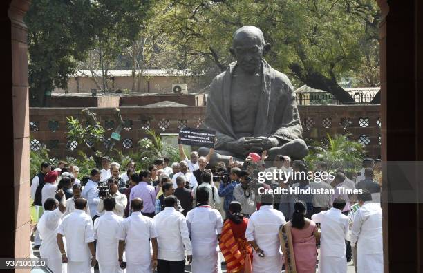 Congress party and AIADMK party MPs protest outside Parliament House against NDA government during Budget Session on March 23, 2018 in New Delhi,...