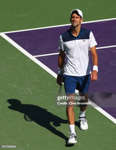 Novak Djokovic of Serbia shows his frustration during his straight sets defeat by Benoit Paire of France in their second round match during the Miami...