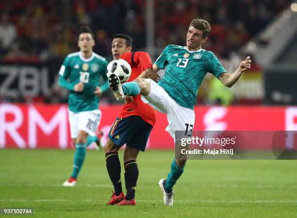 Thomas Mueller of Germany controls the ball ahead of Thiago of Spain during the International friendly match between Germany and Spain at...