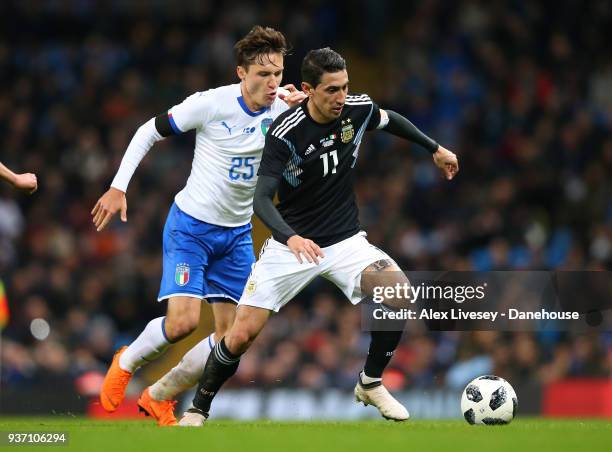 Angel Di Maria of Argentina beats Federico Chiesa of Italy during the International friendly match between Argentina and Italy at Etihad Stadium on...