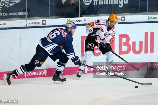 Konrad Abeltshauser of Red Bull Munich vies Jordan Owens of Pinguins Bremerhaven during the DEL Playoff Quarterfinal match 5 between the EHC Red Bull...