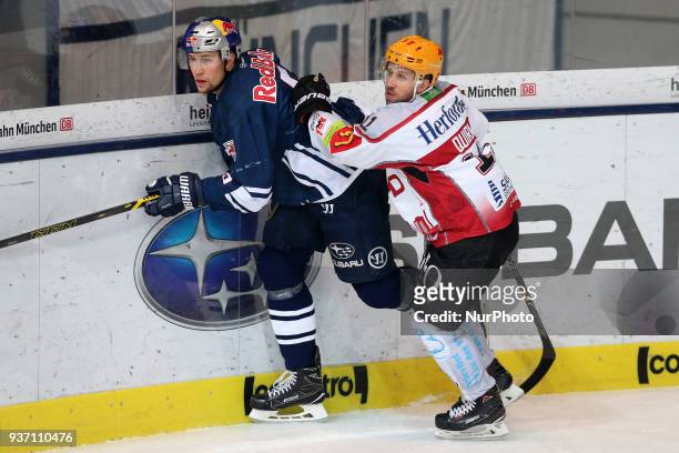 Cory Quirk of Pinguins Bremerhaven vies Keith Aulie of Red Bull Munich during the DEL Playoff Quarterfinal match 5 between the EHC Red Bull Munich...