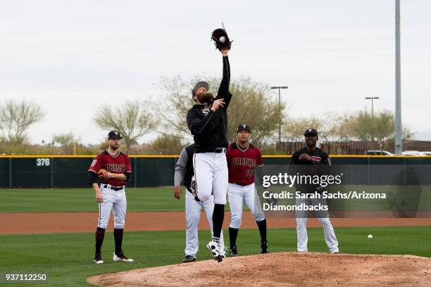 Archie Bradley of the Arizona Diamondbacks runs through drills during Spring Training workouts at Salt River Fields at Talking Stick on February 14,...