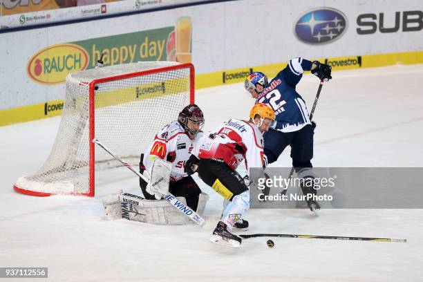 Tomas Poepperle of Pinguins Bremerhaven and Patrick Hager of Red Bull Munich during the DEL Playoff Quarterfinal match 5 between the EHC Red Bull...