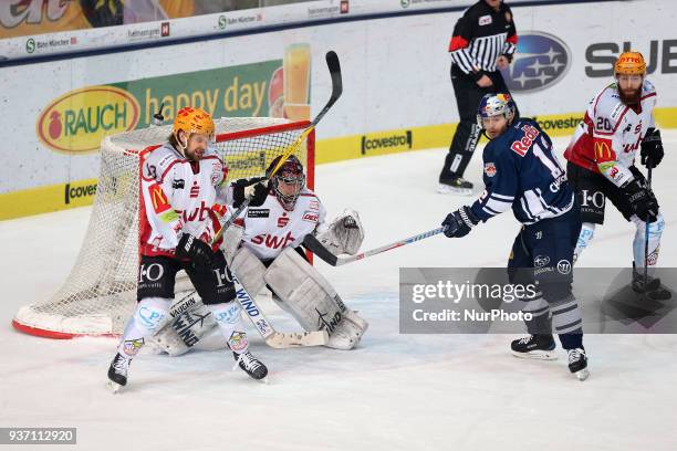 Rylan Schwartz of Pinguins Bremerhaven and Mads Christensen of Red Bull Munich during the DEL Playoff Quarterfinal match 5 between the EHC Red Bull...