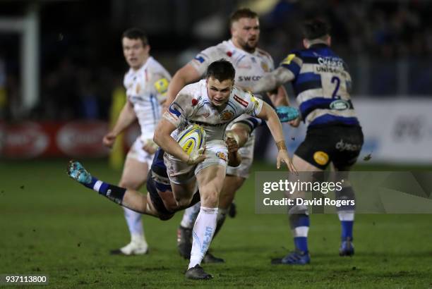 Joe Simmonds of Exeter Chiefs is tackled by Tom Ellis of Bath during the Aviva Premiership match between Bath Rugby and Exeter Chiefs at Recreation...