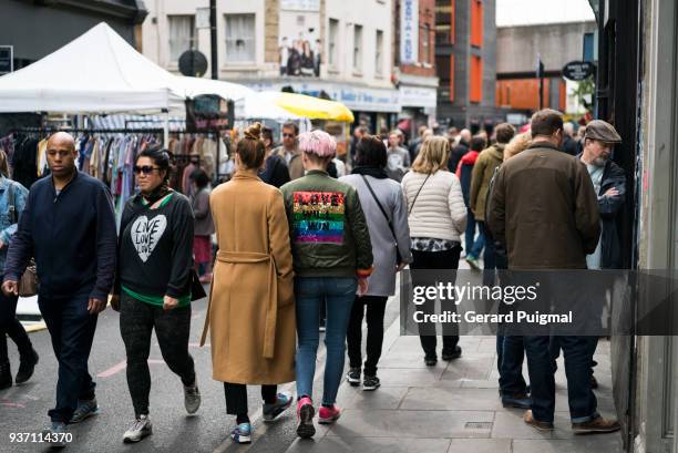 people walking through brick lane on a sunday during spring - gerard puigmal stock pictures, royalty-free photos & images