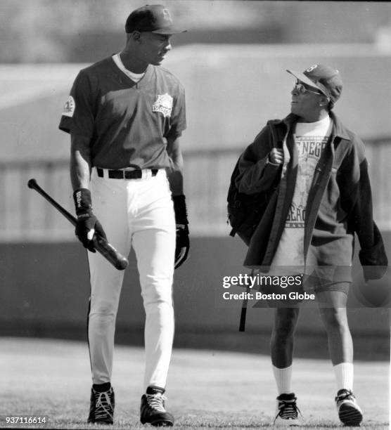 Michael Jordan, left, and movie director Spike Lee, right, speak at Scottsdale Stadium in Scottsdale, Az., Nov. 13, 1994. Jordan is playing baseball...