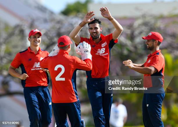 Sam Hain , Alex Davies , Saqib Mahmood and Brett DâOliveira of North celebrate the dismissal of Laurie Evans of South during the ECB North v South...
