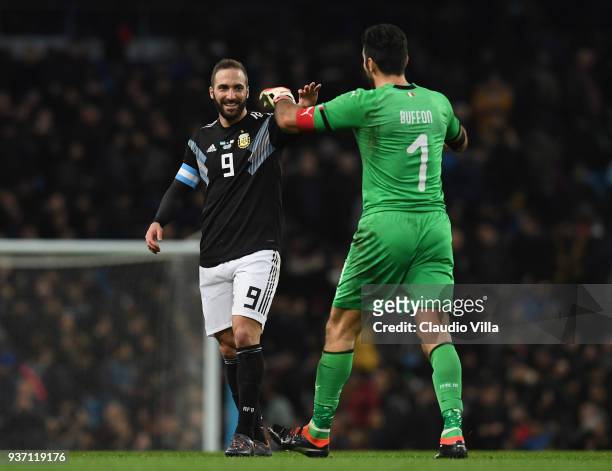 Gianluigi Buffon of Italy and Gonzalo Higuain of Argentina leave the pitch at half time during the International friendly match between Italy and...