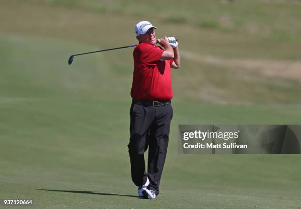 Mark Calcavecchia watches his second shot on the 18th hole during the first round of the Rapiscan Systems Classic at Fallen Oak Golf Course on March...