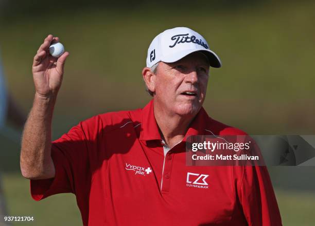 Mark Calcavecchia waves to the gallery after making a par on the 18th hole during the first round of the Rapiscan Systems Classic at Fallen Oak Golf...