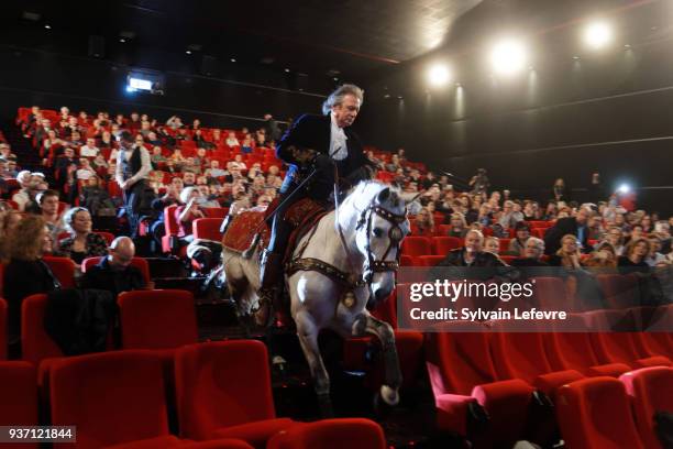 French equestrian stuntman Mario Luraschi enters on horseback in the ceremony hall for the tribute dedicated to him during Valenciennes Film Festival...