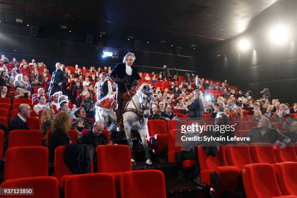 French equestrian stuntman Mario Luraschi enters on horseback in the ceremony hall for the tribute dedicated to him during Valenciennes Film Festival...