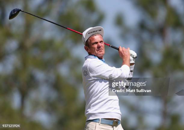 Jesper Parnevik of Sweden watches his tee shot on the second hole during the first round of the Rapiscan Systems Classic at Fallen Oak Golf Course on...