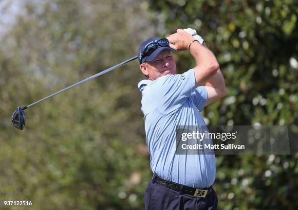 Woody Austin watches his tee shot on the 18th hole during the first round of the Rapiscan Systems Classic at Fallen Oak Golf Course on March 23, 2018...