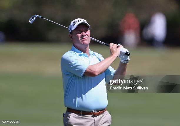 Joe Durant watches his second shot on the first hole during the first round of the Rapiscan Systems Classic at Fallen Oak Golf Course on March 23,...