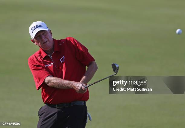 Mark Calcavecchia hits his third shot on the 18th hole during the first round of the Rapiscan Systems Classic at Fallen Oak Golf Course on March 23,...