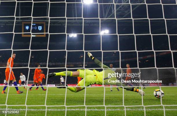 Jeroen Zoet of the Netherlands fails to stop Jessie Lingard of England from scoring their first goal during the international friendly match between...