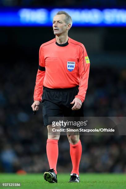 Referee Martin Atkinson looks on during the international friendly match between Italy and Argentina at the Etihad Stadium on March 23, 2018 in...