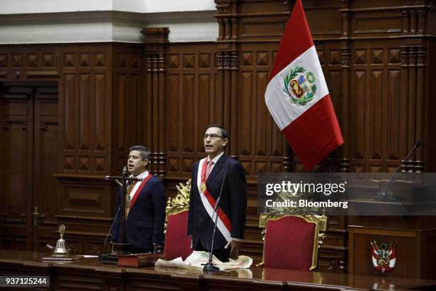 Martin Vizcarra, Peru's president, right, stands for the national anthem during a swearing in ceremony in Lima, Peru, on Friday, March 23, 2018....