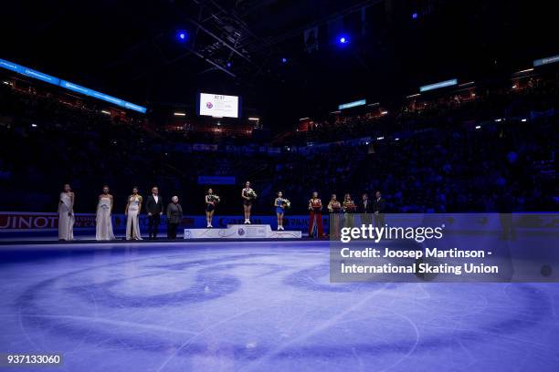 Wakaba Higuchi of Japan, Kaetlyn Osmond of Canada and Satoko Miyahara of Japan pose in the Ladies medal ceremony during day three of the World Figure...