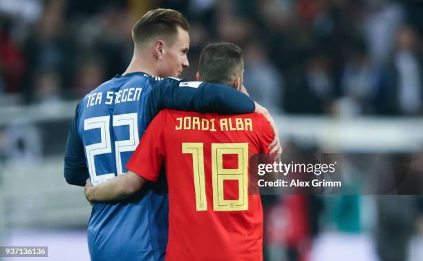 Marc-Andre ter Stegen of Germany hugs Jordi Alba of Spain after the international friendly match between Germany and Spain at Esprit-Arena on March...