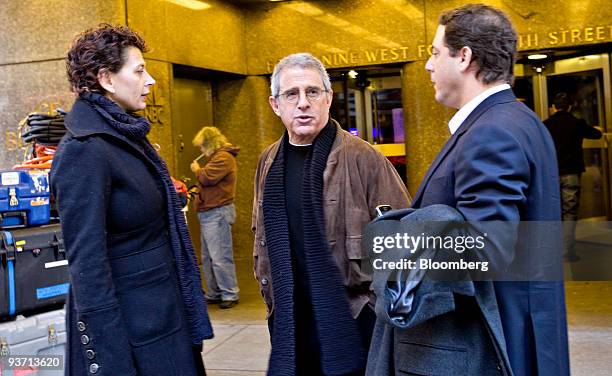 Ron Meyer, president and chief operating officer of NBC Universal Inc., center, exits NBC Studios in New York, U.S., on Thursday, Dec. 3, 2009....